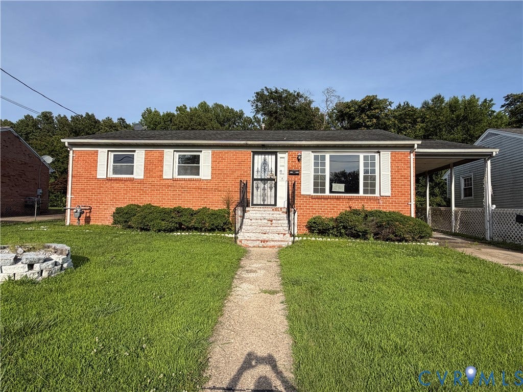 1121 E Booker Circle, Petersburg, VA 23803 Brick ranch-style exterior with a covered carport