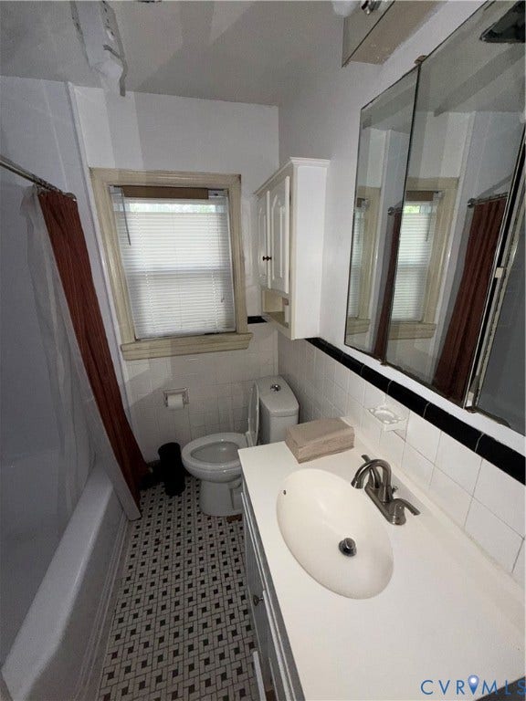3605 Dill Road, Henrico, VA 23222 White vanity with an integrated sink and brushed nickel faucet