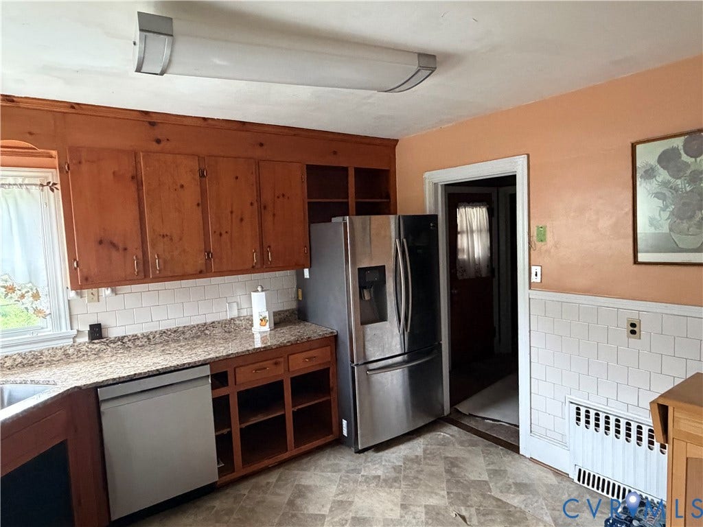 3605 Dill Road, Henrico, VA 23222 Kitchen space featuring wood cabinetry, white subway tile backsplash, and a light-toned countertop