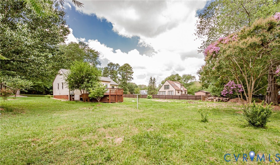 2015 Fordson Road, Richmond, VA 23229 Expansive grassy yard with mature trees and a flowering crepe myrtle