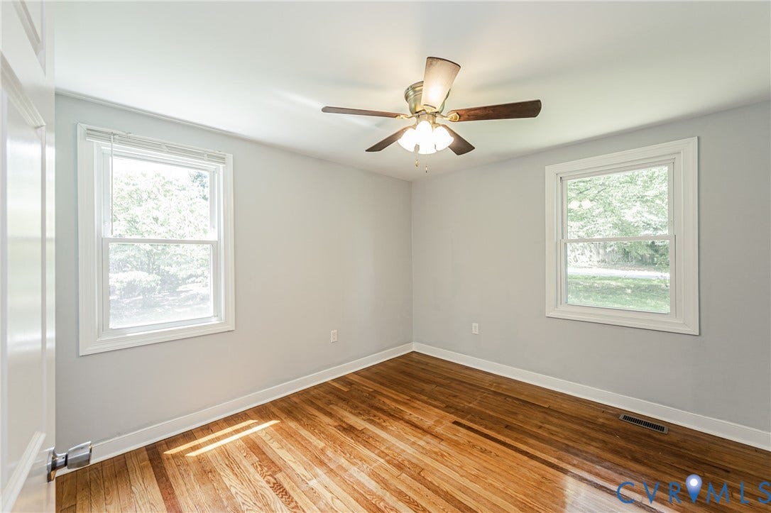 2015 Fordson Road, Richmond, VA 23229 Room featuring wood-finish flooring, light grey painted walls, and a ceiling fan with light fixture