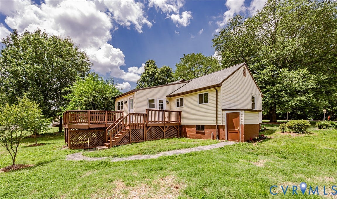2015 Fordson Road, Richmond, VA 23229 Spacious exterior deck with wood railings and lattice skirting