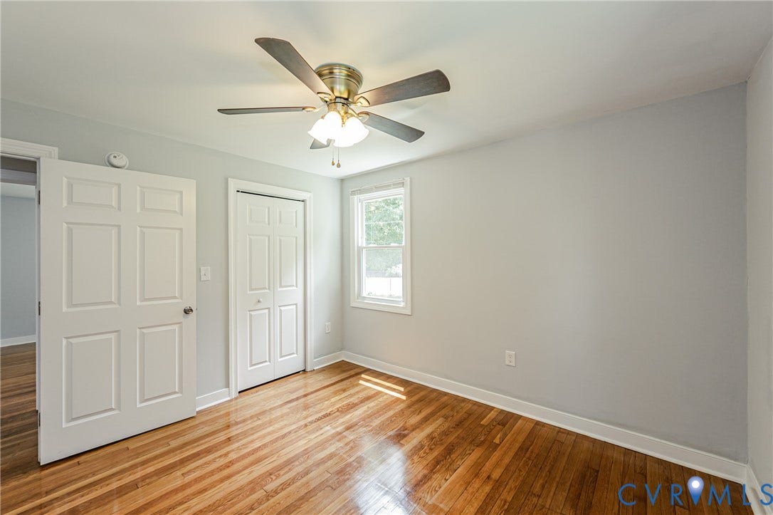 2015 Fordson Road, Richmond, VA 23229 Room featuring wood-finish flooring, light grey painted walls, and white trim