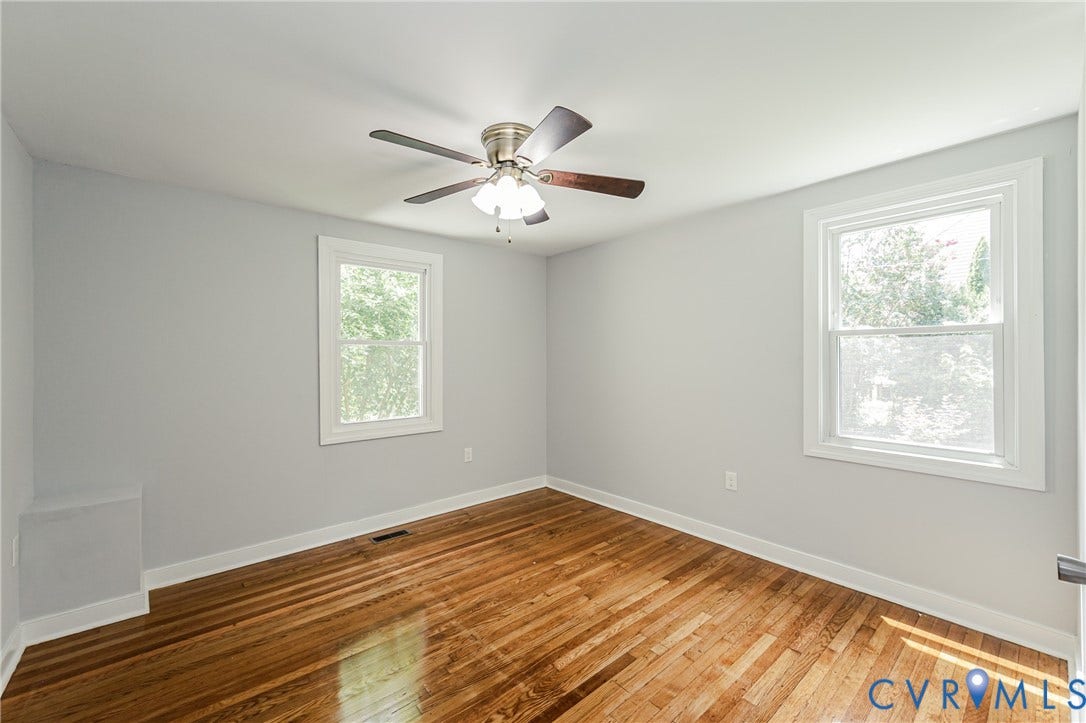 2015 Fordson Road, Richmond, VA 23229 Room featuring wood-finish flooring, two large windows, a ceiling fan with integrated lighting, and light gray wall finishes