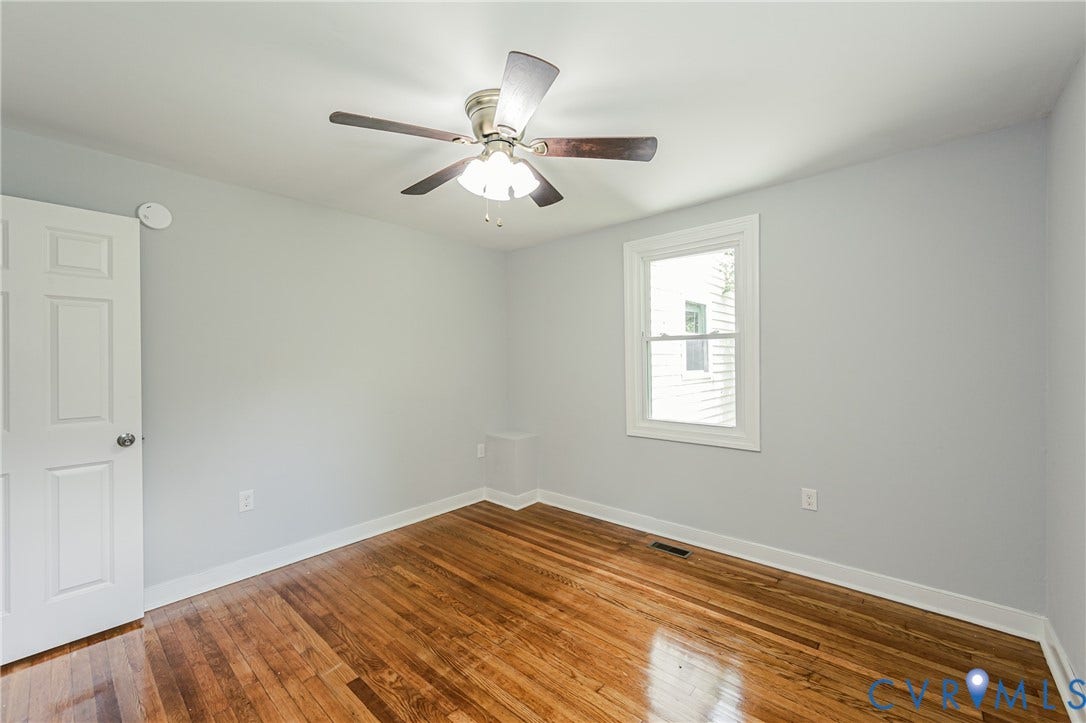 2015 Fordson Road, Richmond, VA 23229 Bright room featuring wood-finish flooring, a ceiling fan with integrated lighting, and a white-trimmed window