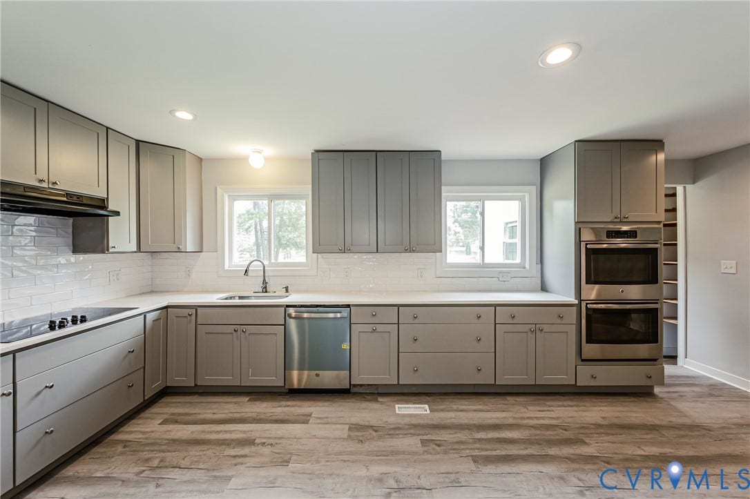 2015 Fordson Road, Richmond, VA 23229 Kitchen featuring light gray cabinetry, white countertops, subway tile backsplash, and wood-finish flooring
