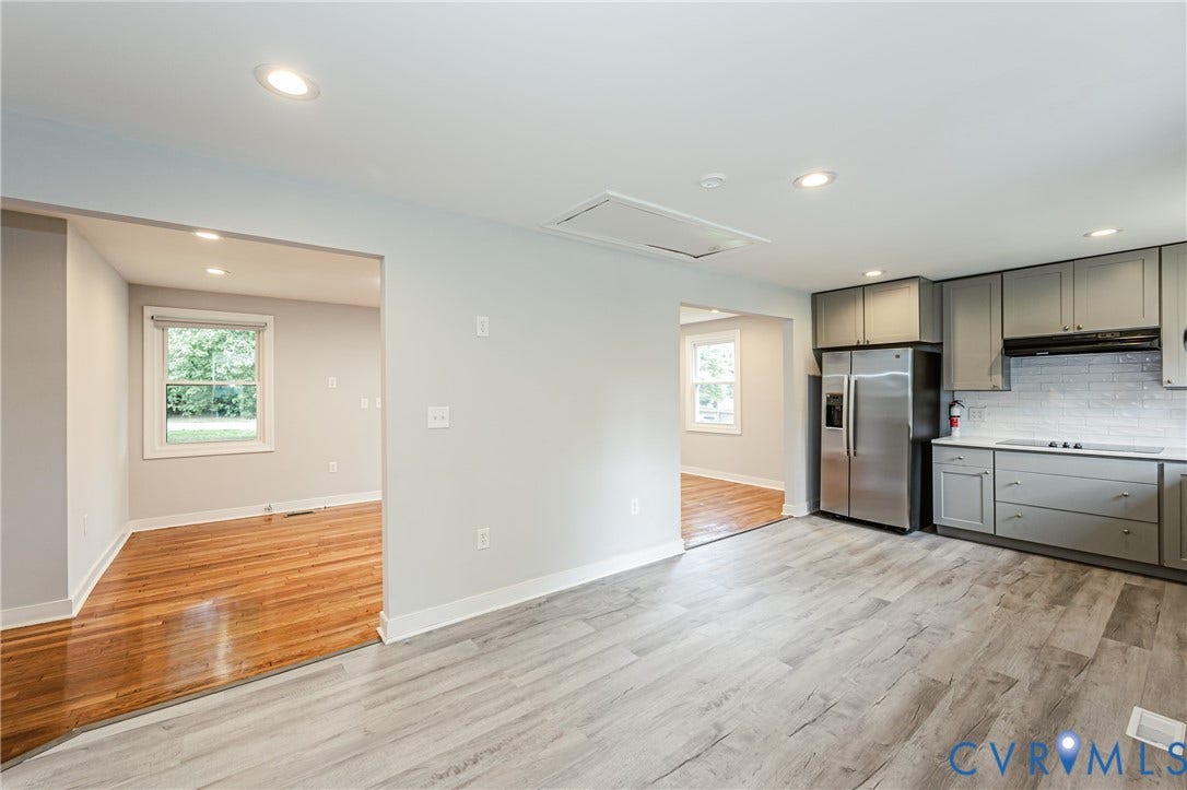 2015 Fordson Road, Richmond, VA 23229 Modern kitchen featuring grey cabinetry, stainless steel appliances, and wood-finish flooring