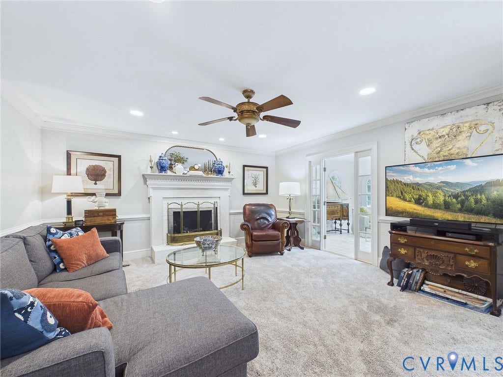 14301 Creek Stone Drive, Chesterfield, VA 23838 Living area featuring a white fireplace with a brass firebox, recessed lighting, crown molding, and light-colored carpeting