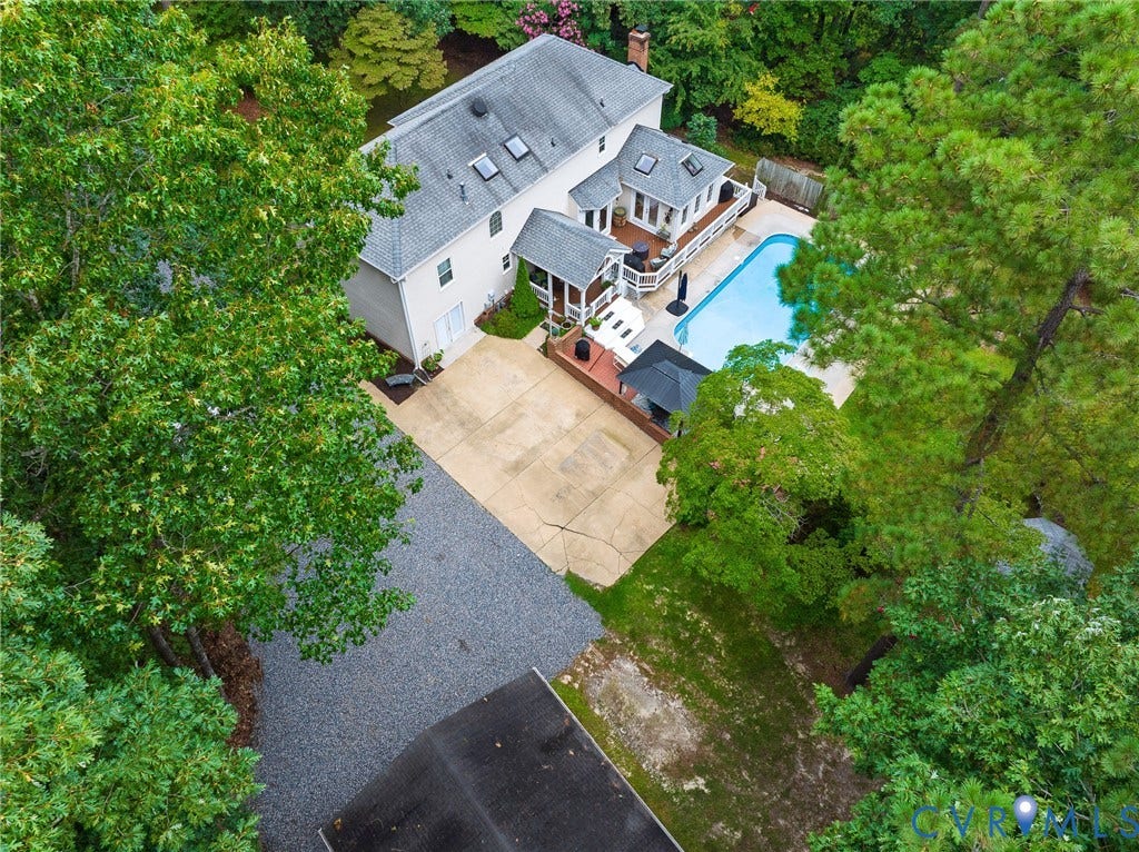 14301 Creek Stone Drive, Chesterfield, VA 23838 Expansive backyard featuring a rectangular swimming pool, multiple outdoor deck areas, and a covered patio structure