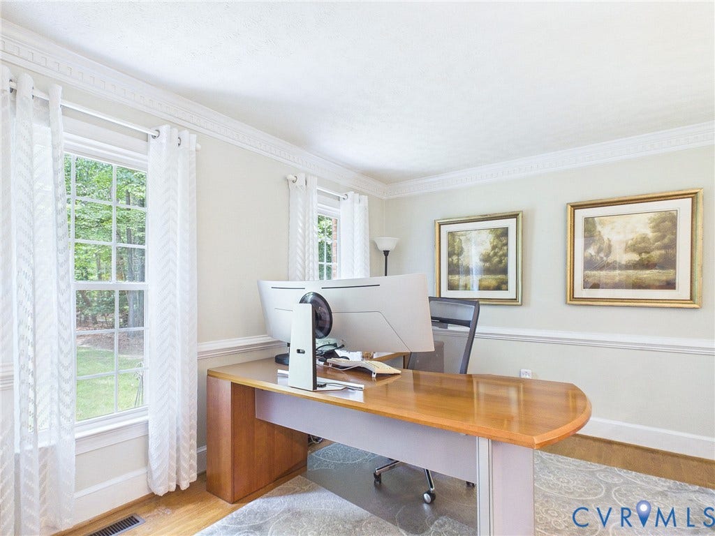 14301 Creek Stone Drive, Chesterfield, VA 23838 Room featuring crown molding, chair rail molding, multiple windows, wood-finish flooring, and a patterned area rug
