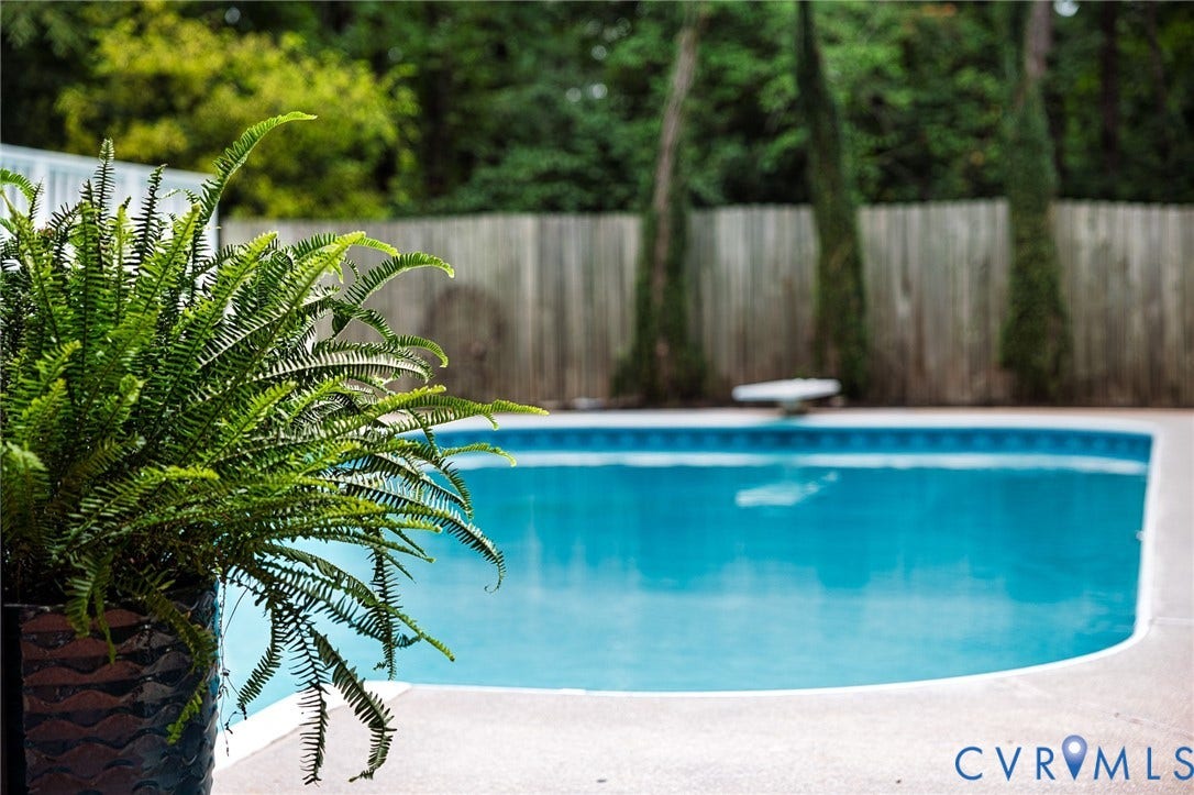 14301 Creek Stone Drive, Chesterfield, VA 23838 In-ground swimming pool with a blue tile border and a white diving board