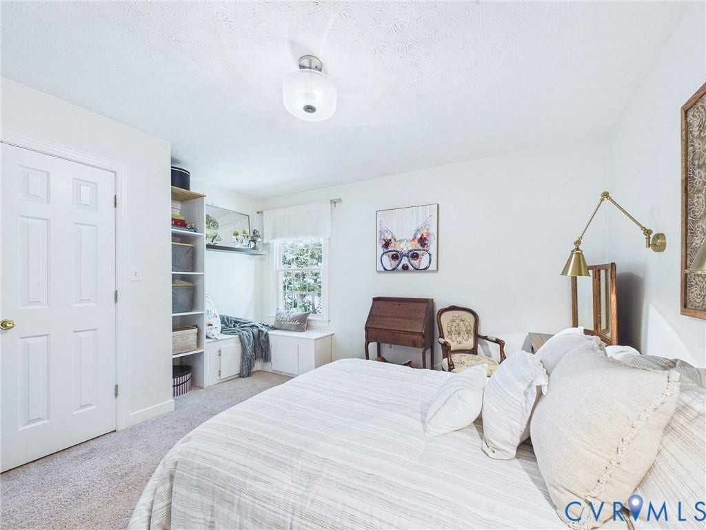 14301 Creek Stone Drive, Chesterfield, VA 23838 Light-filled room featuring a built-in window bench, integrated shelving, neutral wall colors, and wall-to-wall carpeting