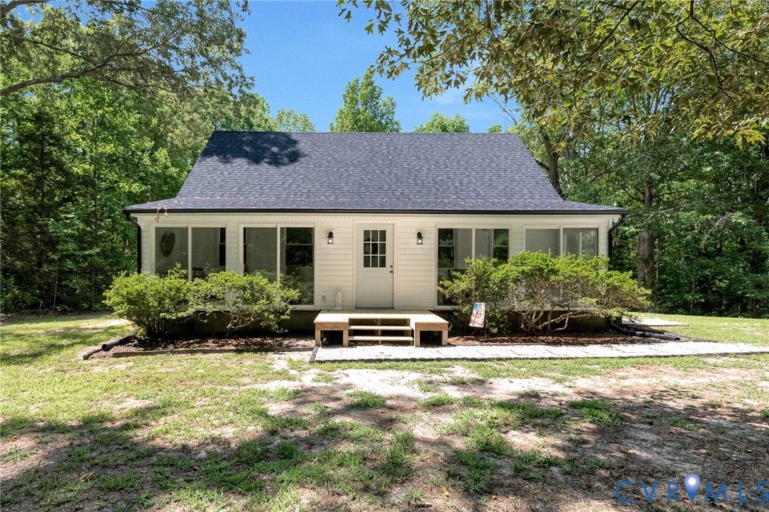 348 Forest Lane, Timberland Estates, King William, VA 23086 Charming single-story residence with white horizontal siding and a dark shingle roof