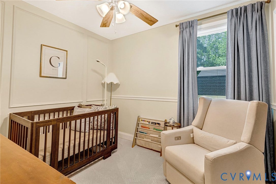 348 Forest Lane, Timberland Estates, King William, VA 23086 Room featuring light-colored walls with decorative molding, a ceiling fan with wood-finish blades, and a window with blinds and gray curtains