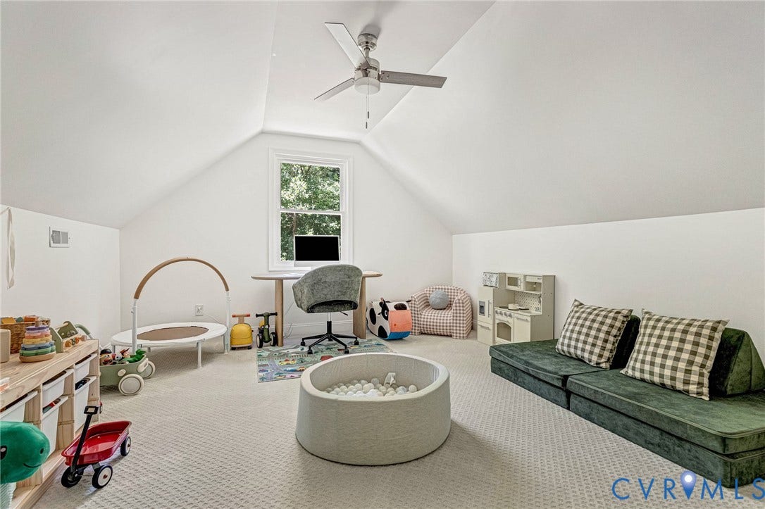 348 Forest Lane, Timberland Estates, King William, VA 23086 Attic space featuring sloped ceilings, a centered window, and a ceiling fan