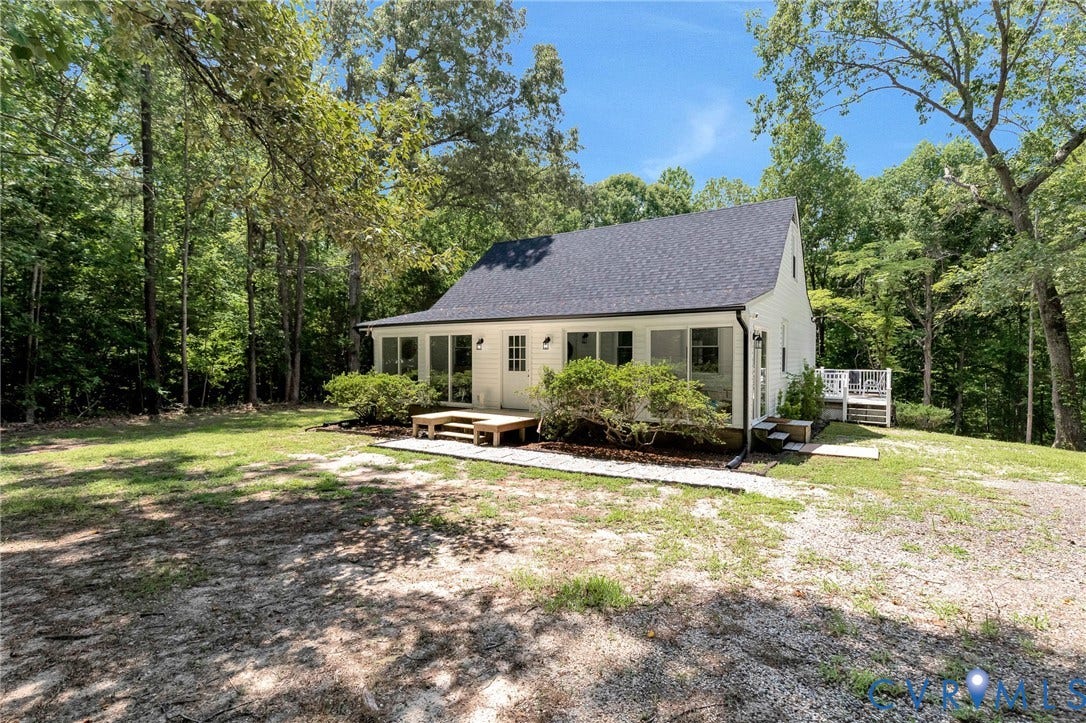 348 Forest Lane, Timberland Estates, King William, VA 23086 White siding residence with a dark shingle roof
