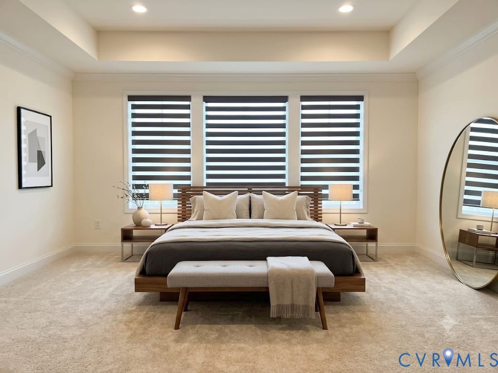 18037 Bay Point Way, Moseley, VA 23120 Spacious room featuring a tray ceiling with recessed lighting, three large windows with blinds, and neutral carpeting