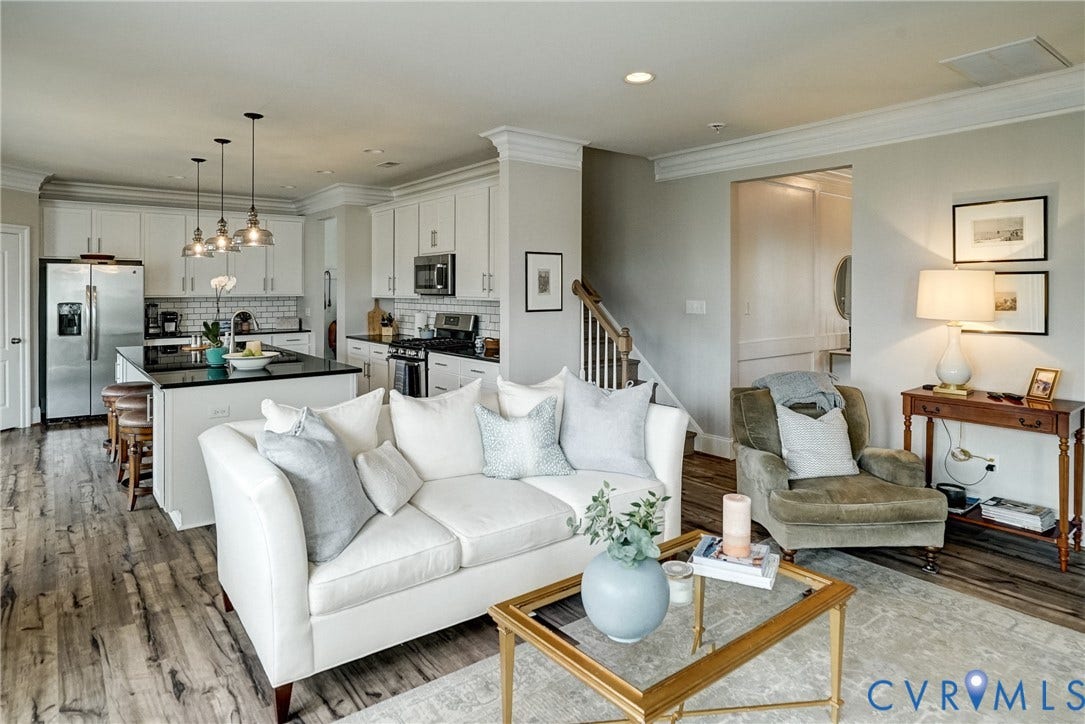 18024 Twin Falls Lane, Aston Oaks, Moseley, VA 23120 Open-concept living space featuring wood-finish flooring, crown molding, and recessed lighting