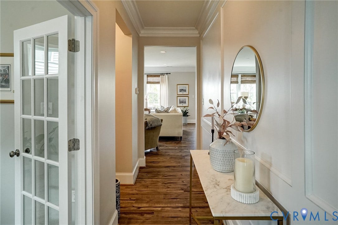 18024 Twin Falls Lane, Aston Oaks, Moseley, VA 23120 Hallway featuring wood-finish flooring, crown molding, and wainscoting