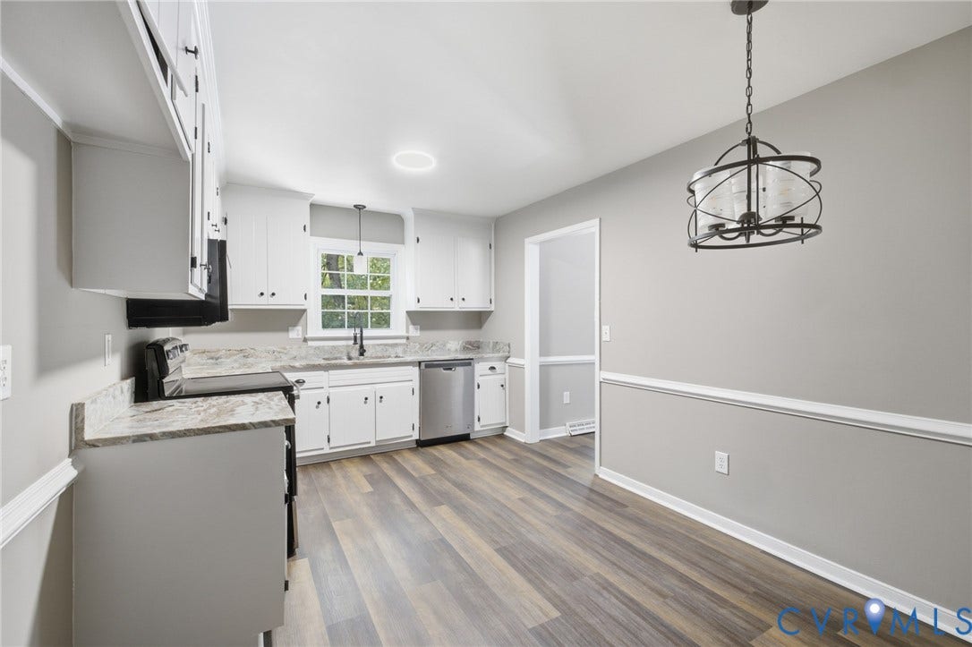 3224 Wyntrebrooke Drive, North Chesterfield, VA 23235 Kitchen and dining area featuring wood-finish flooring, white cabinetry, granite countertops, and stainless steel appliances