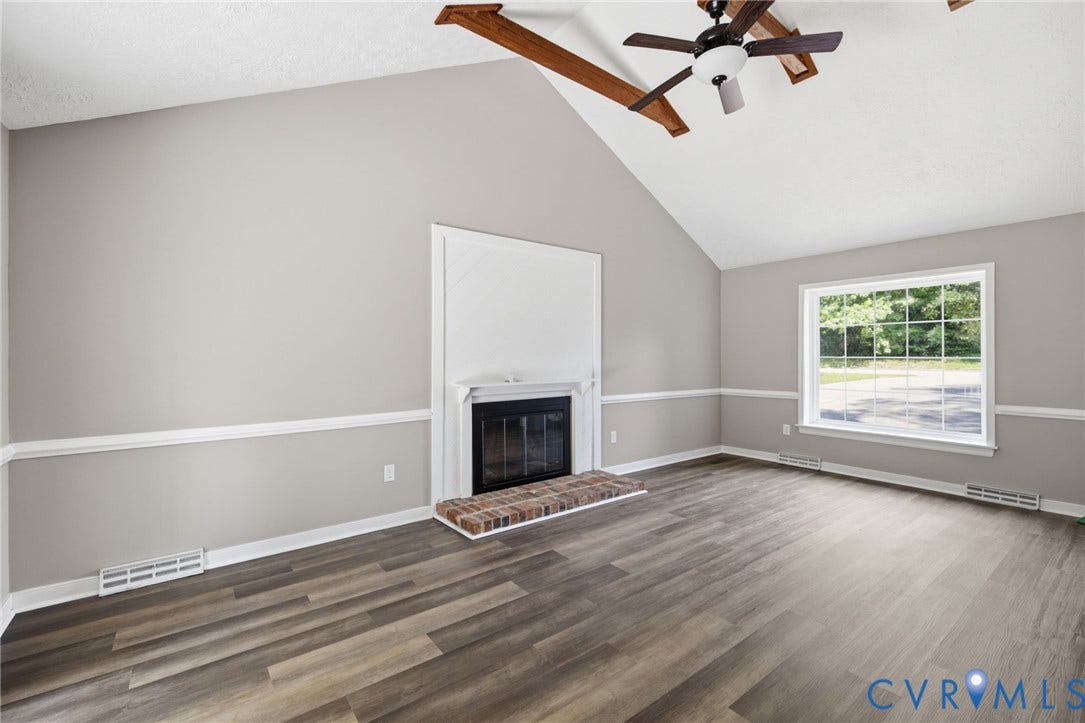 3224 Wyntrebrooke Drive, North Chesterfield, VA 23235 Living space featuring a vaulted ceiling with exposed wood beams, a ceiling fan, and wood-finish flooring