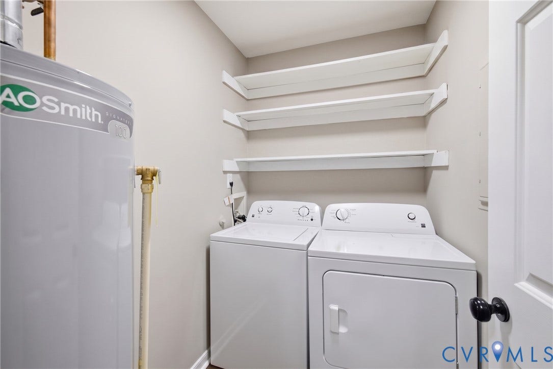 3224 Wyntrebrooke Drive, North Chesterfield, VA 23235 Dedicated laundry area featuring a white washing machine and dryer, along with three wall-mounted white shelves