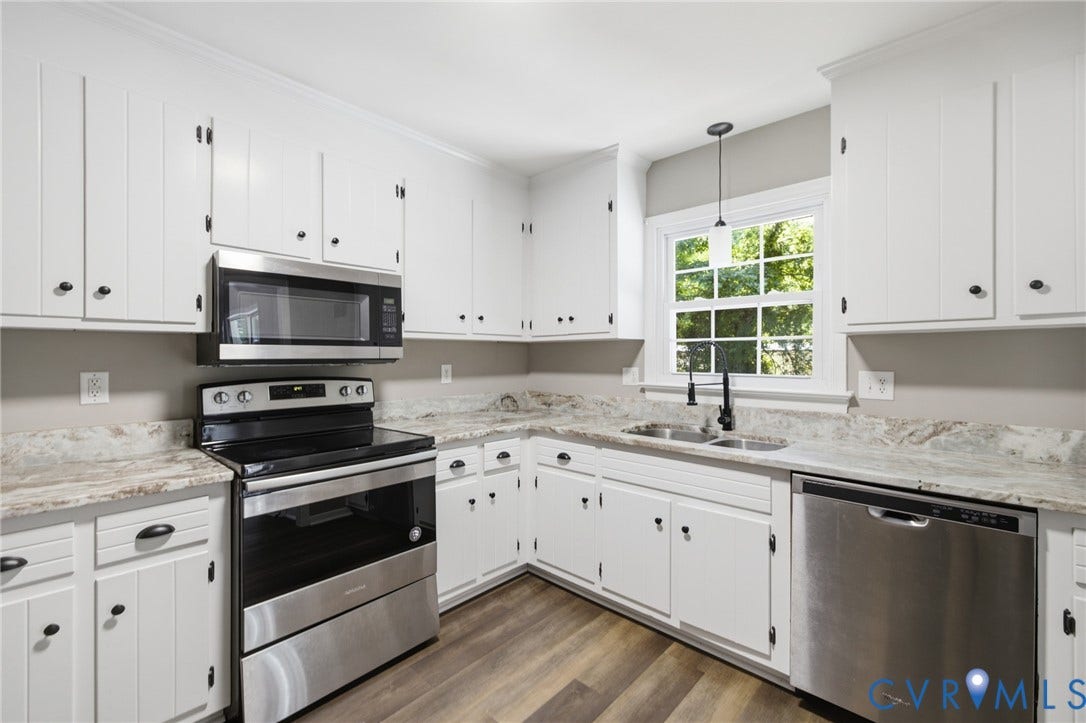 3224 Wyntrebrooke Drive, North Chesterfield, VA 23235 Kitchen featuring white cabinetry with dark hardware, stone-finish countertops, and stainless steel appliances