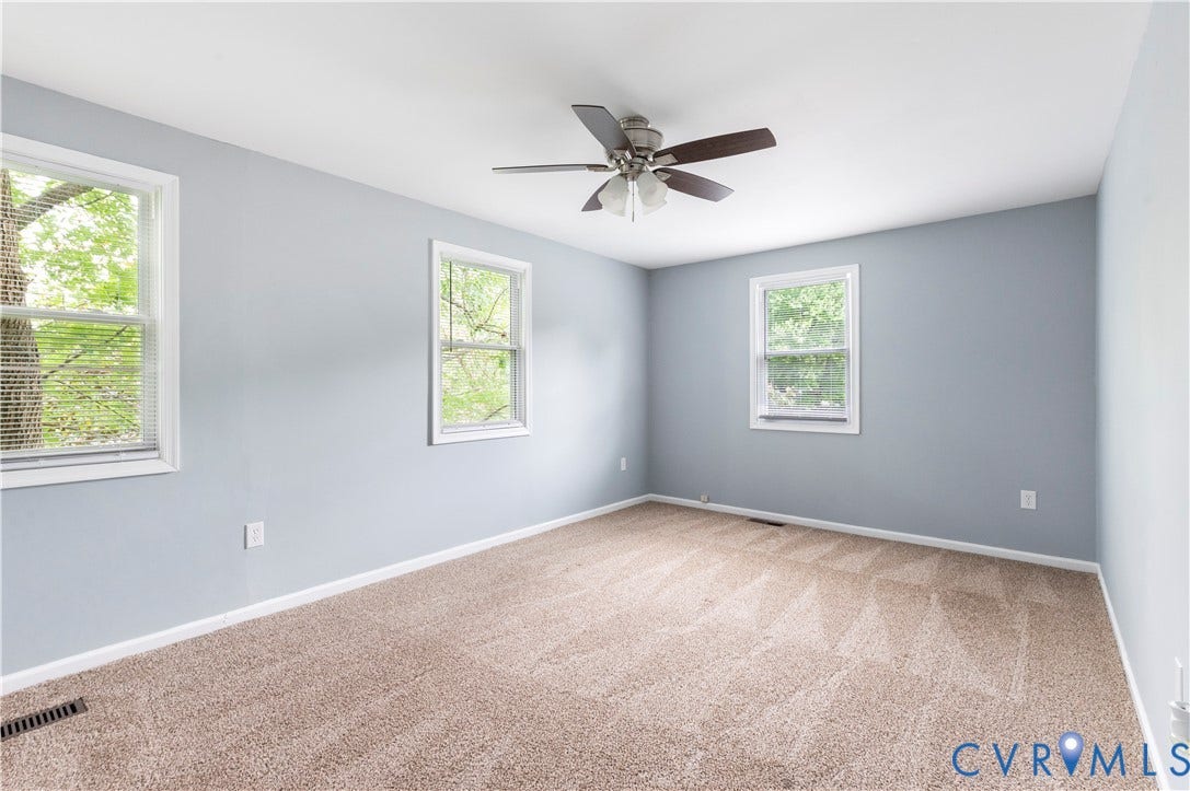 908 Winterstick Place, Highland Springs, VA 23223 carpeting, a ceiling fan with integrated lighting, and three double-hung windows with white frames