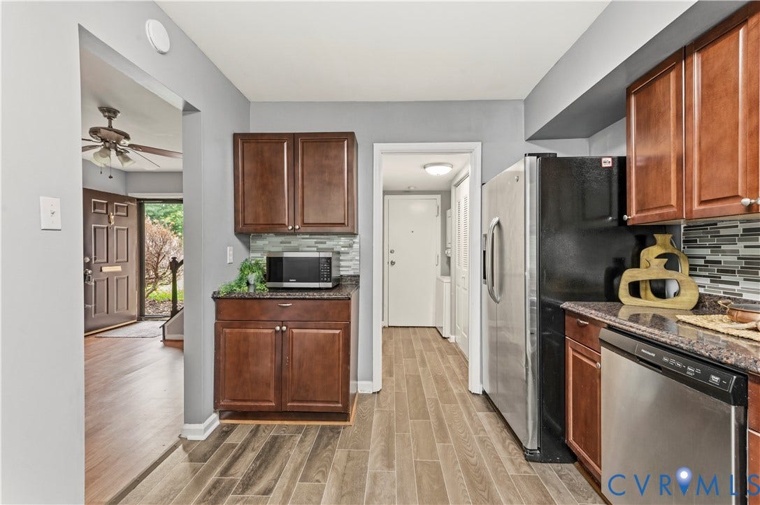 908 Winterstick Place, Highland Springs, VA 23223 Kitchen featuring wood-finish flooring, dark wood cabinetry, and stainless steel appliances