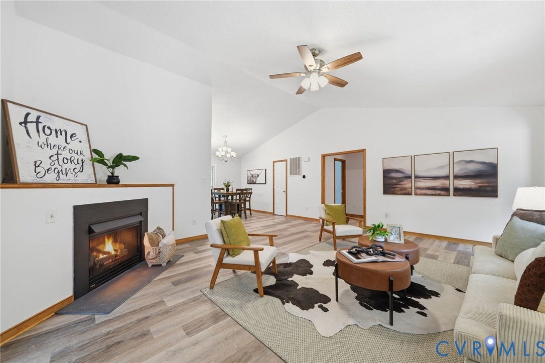 2231 Red Lane Road, Powhatan, VA 23139 Filled w/natural light & designed for connection, this inviting great room offers a cozy fireplace, easy-care flooring, & plenty of space for family time, playtime, & everything in between.