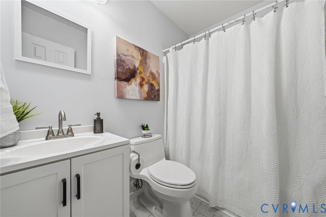 2231 Red Lane Road, Powhatan, VA 23139 Serving the adjacent bedrooms w/ease, this well-appointed hall bath features a white vanity w/ample storage, tub/shower combo & a sleek brushed stainless faucet.