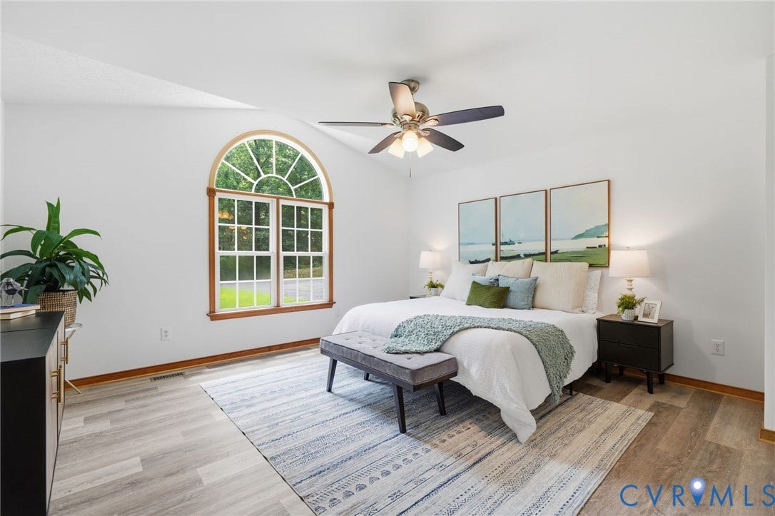 2231 Red Lane Road, Powhatan, VA 23139 Tasteful & inviting, the generous primary suite features a stunning Palladian window & higher ceiling w/ ceiling fan all enhancing the room's airy ambiance & tranquil appeal.