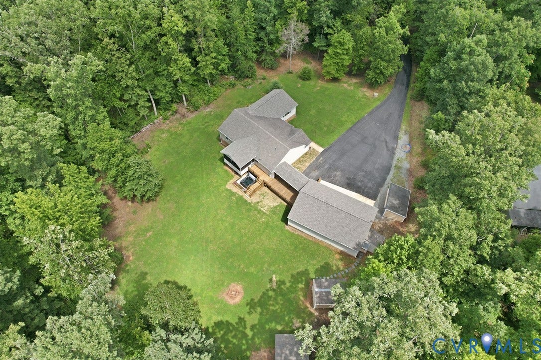 2231 Red Lane Road, Powhatan, VA 23139 A rare blend of space, seclusion, & scenic surroundings, this expansive wooded property offers a beautifully updated home w/a 3-car garage, sweeping lawn, & a winding paved driveway that welcomes you home.