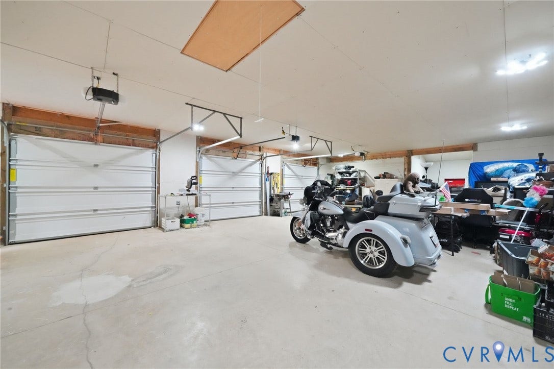 2231 Red Lane Road, Powhatan, VA 23139 From weekend projects to serious woodworking/restoration, or home business pursuits, this garage is equipped to handle it all. Complete w/workshop, cabinetry, auto openers for each bay door, & 100-amp electrical service, this is a space where passions can thrive.
