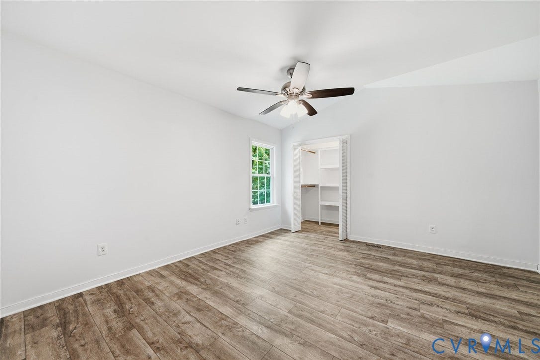 2231 Red Lane Road, Powhatan, VA 23139 Bedroom #2 - Thoughtfully designed, this bedroom features a generous walk-in closet, durable LVP flooring, & a ceiling fan w/light for added comfort.