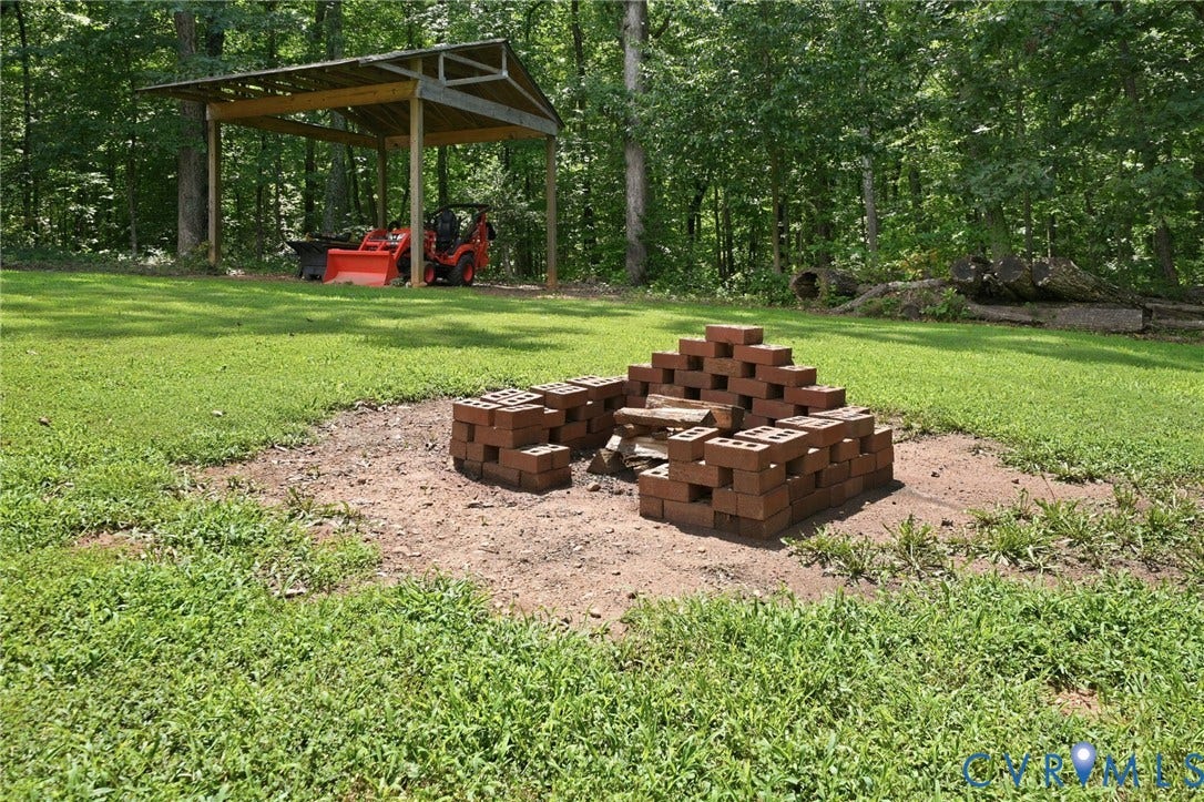 2231 Red Lane Road, Powhatan, VA 23139 Made for gathering, this backyard retreat invites marshmallow roasting & cozy nights by the fire or celebrations under the pavilion.