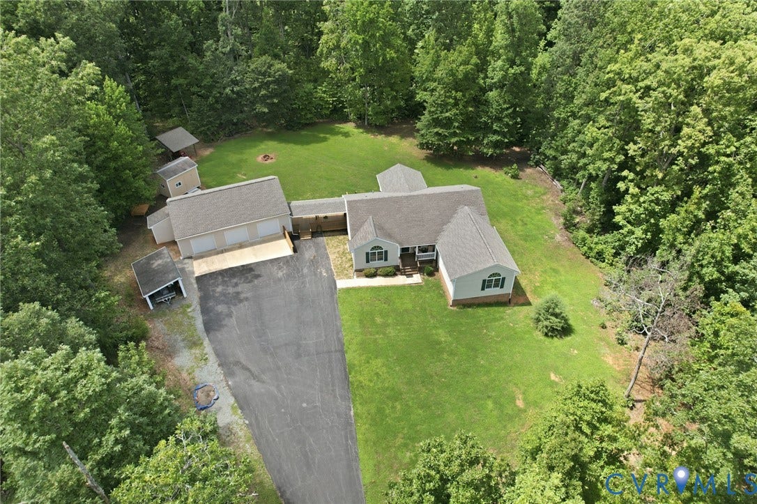 2231 Red Lane Road, Powhatan, VA 23139 Set on a picturesque wooded homesite, this impressive property offers the perfect balance of privacy w/expansive outdoor space, mature trees, a beautiful lawn, & a spacious home complete w/an attached 3-car garage.