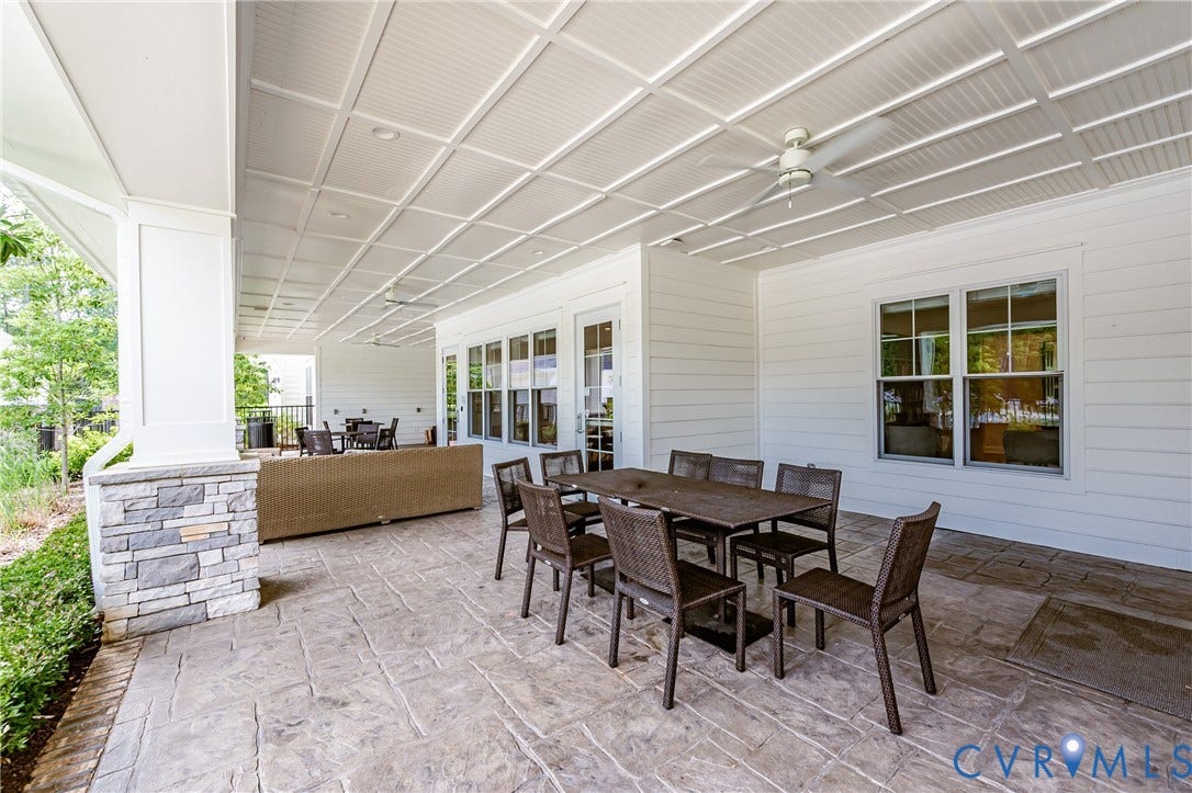 7627 E Danube Loop, New Kent, VA 23124 Expansive covered patio featuring a stamped concrete surface and a coffered ceiling