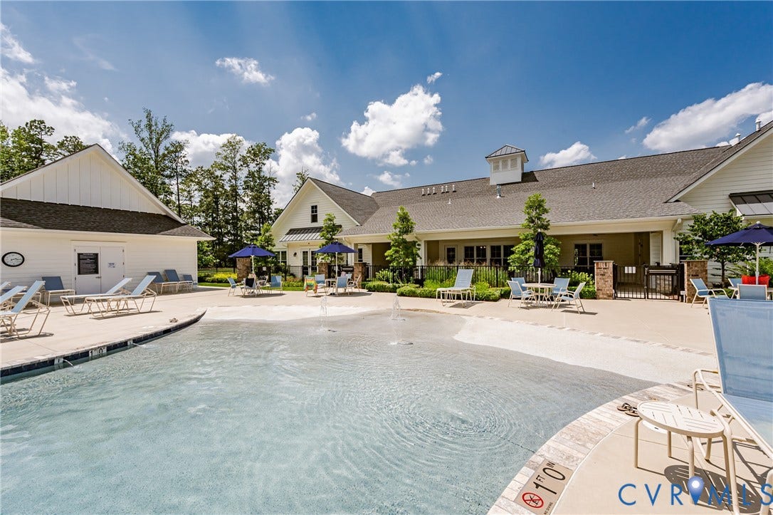 7627 E Danube Loop, New Kent, VA 23124 Resort-style pool with a zero-entry design and integrated water features