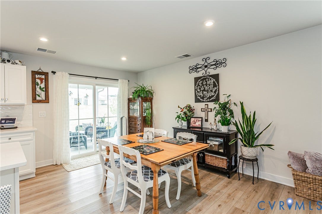 7627 E Danube Loop, New Kent, VA 23124 Bright interior space featuring wood-finish flooring, recessed lighting, and a neutral color palette