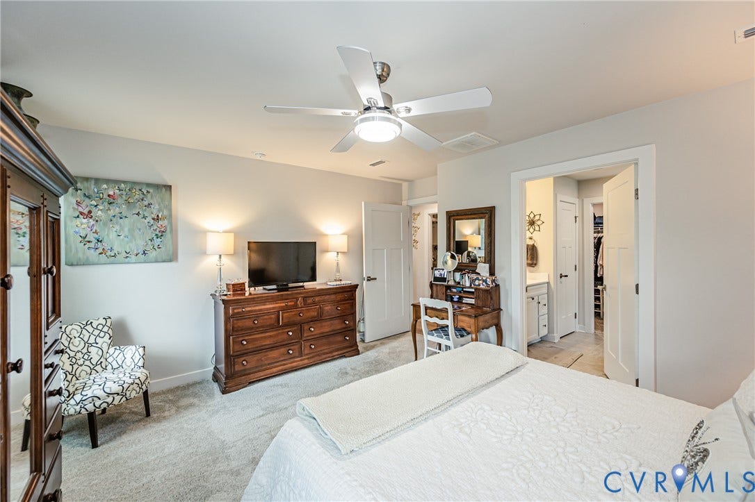7627 E Danube Loop, New Kent, VA 23124 Carpeted interior space featuring a ceiling fan with integrated lighting, recessed lighting, and white trim work