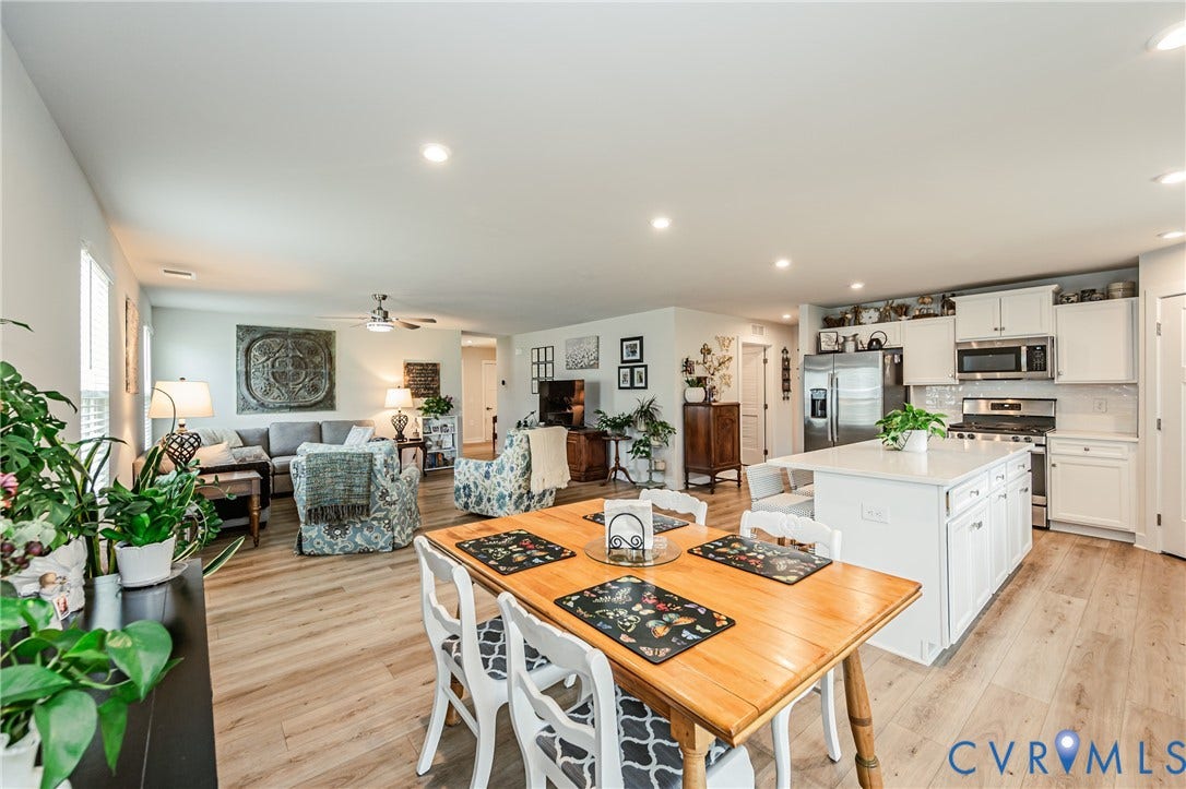 7627 E Danube Loop, New Kent, VA 23124 Expansive open-concept layout featuring wood-finish flooring throughout