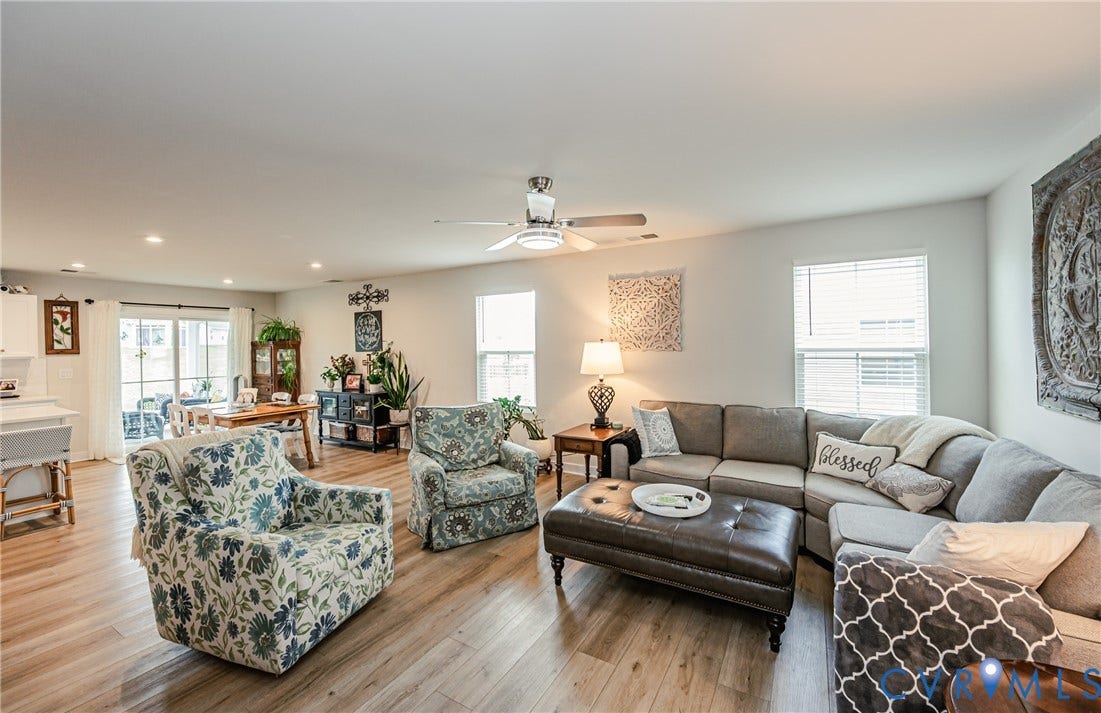 7627 E Danube Loop, New Kent, VA 23124 Open-concept living area featuring wood-finish flooring, recessed lighting, and a ceiling fan