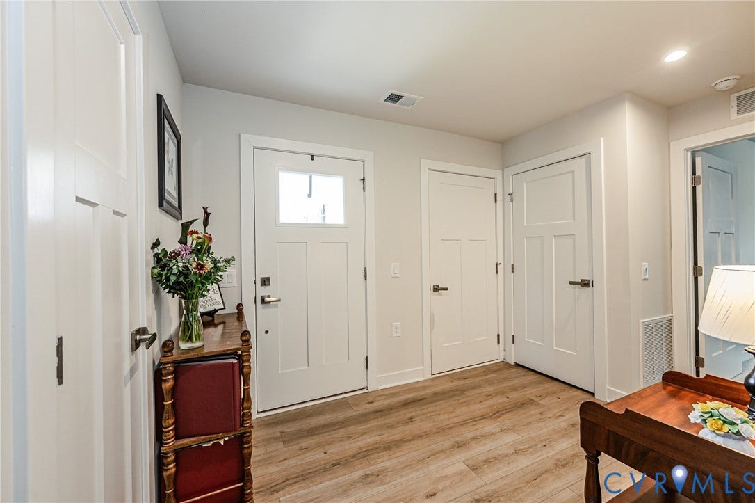 7627 E Danube Loop, New Kent, VA 23124 Entryway featuring light wood-finish flooring and contemporary interior doors