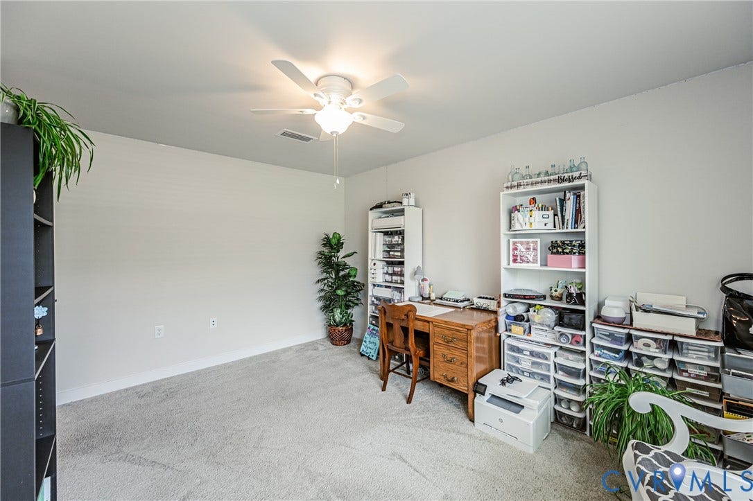 7627 E Danube Loop, New Kent, VA 23124 Carpeted room with a ceiling fan light fixture