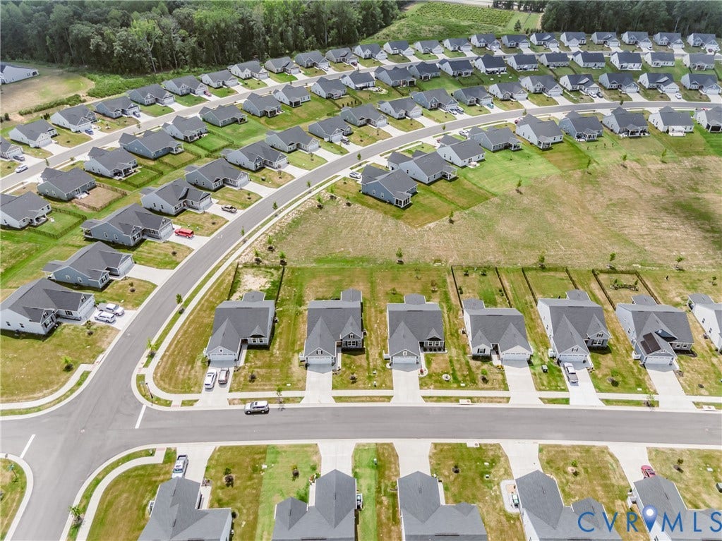 7627 E Danube Loop, New Kent, VA 23124 Aerial perspective showcasing a residential community with numerous single-family homes
