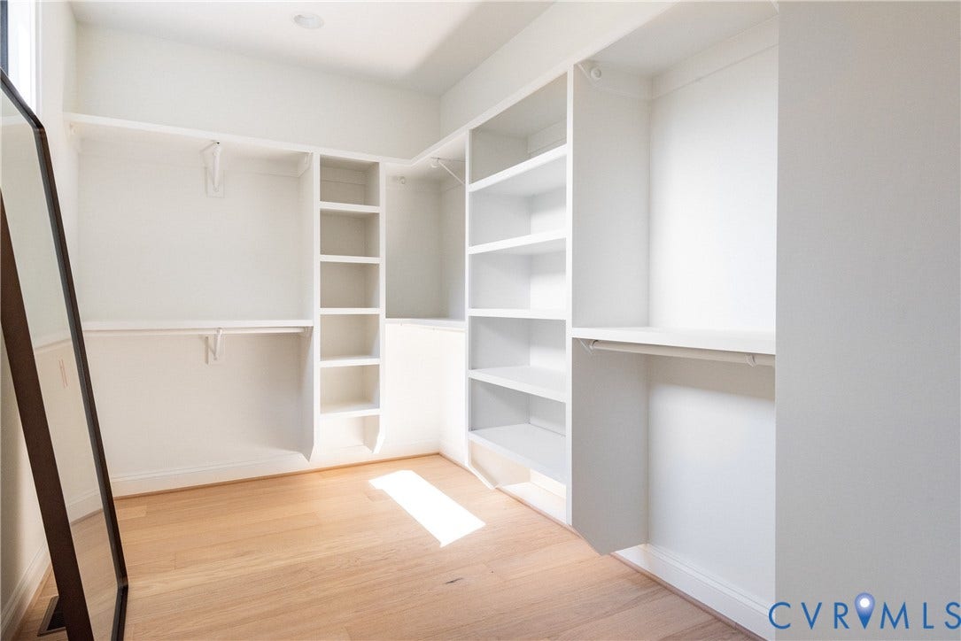 4507 Leonard Parkway, Richmond, VA 23221 Spacious walk-in closet featuring light wood-finish flooring, recessed lighting, multiple shelving units, and hanging rods