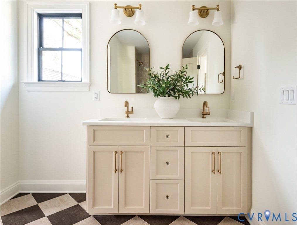 4507 Leonard Parkway, Richmond, VA 23221 Dual vanity with light-toned cabinetry, white countertops, and integrated sinks