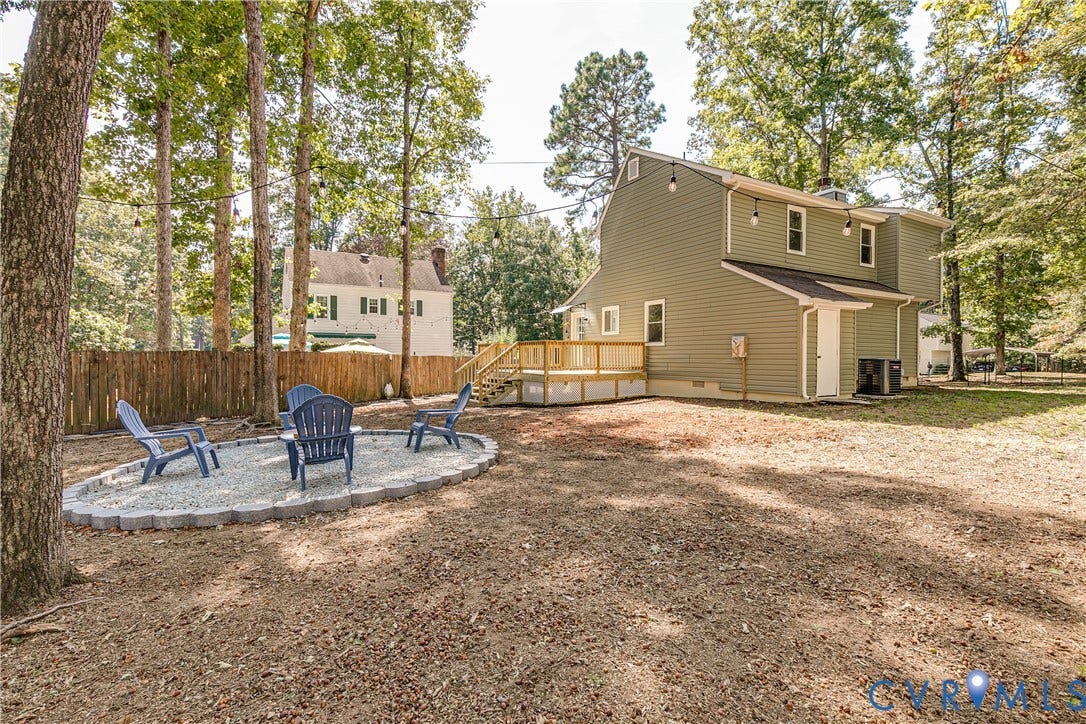 Tree-lined backyard offers a private setting for everyday outdoor living