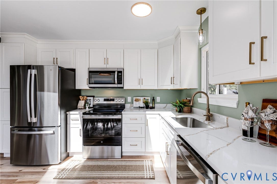 Fresh, modern kitchen with ample cabinetry and updated finishes